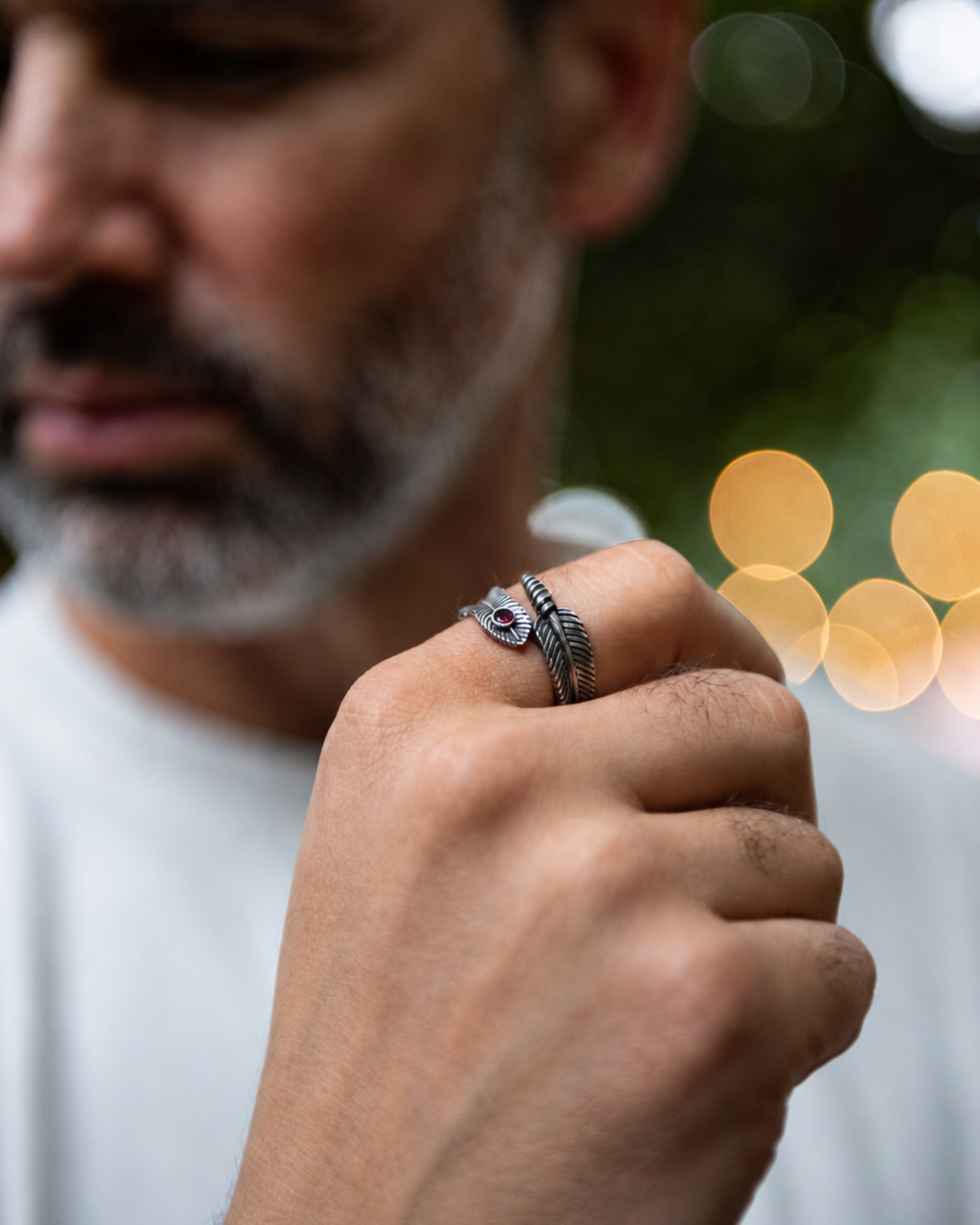 Feather ring with deep ruby red stone